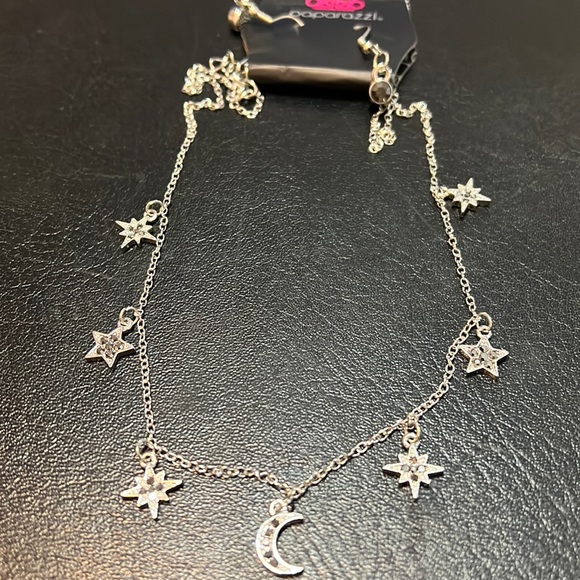 Short silver necklace with star and moon charms